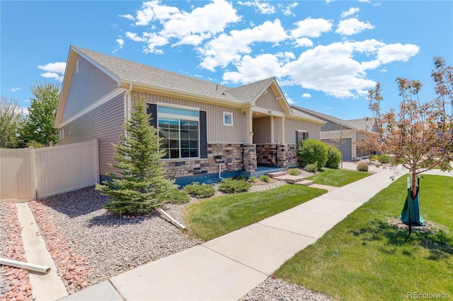 6717 Golden Briar Ln, Colorado Springs, CO 80927 - view of front of house with stone siding and roof with shingles