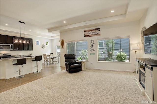 6717 Golden Briar Ln, Colorado Springs, CO 80927 - kitchen with appliances with stainless steel finishes, a kitchen breakfast bar, recessed lighting, open floor plan, and hanging light fixtures