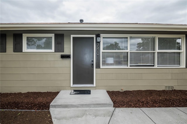740 Moline St, Aurora, CO 80010 - doorway to property featuring crawl space