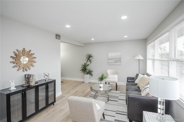 740 Moline St, Aurora, CO 80010 - living area featuring light wood finished floors, recessed lighting, and baseboards