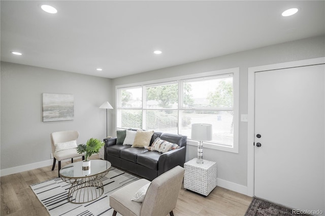 740 Moline St, Aurora, CO 80010 - living room featuring baseboards, recessed lighting, and light wood finished floors