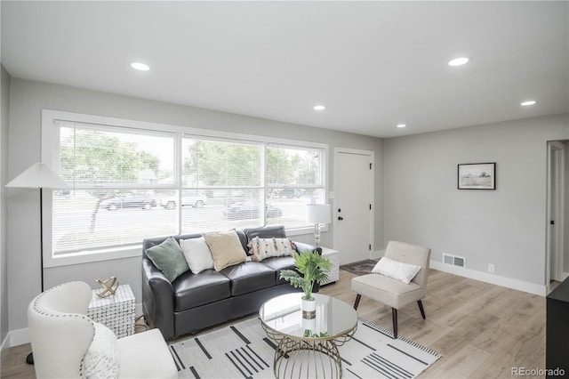 740 Moline St, Aurora, CO 80010 - living room featuring healthy amount of natural light, recessed lighting, baseboards, and light wood finished floors