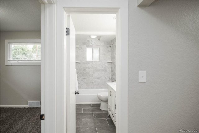 740 Moline St, Aurora, CO 80010 - full bath featuring vanity, healthy amount of natural light, toilet, and bathtub / shower combination