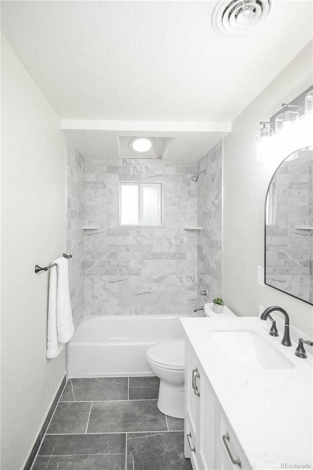 740 Moline St, Aurora, CO 80010 - bathroom with vanity, bathtub / shower combination, toilet, and tile patterned flooring