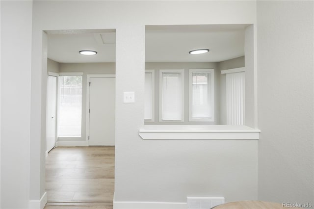 740 Moline St, Aurora, CO 80010 - corridor featuring baseboards and wood finished floors