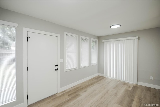 740 Moline St, Aurora, CO 80010 - foyer with light wood-style floors and baseboards