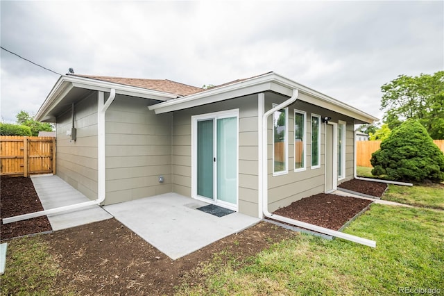 740 Moline St, Aurora, CO 80010 - rear view of property with a patio area and a shingled roof