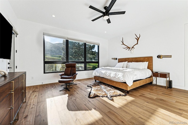 bedroom featuring ceiling fan and light hardwood / wood-style floors