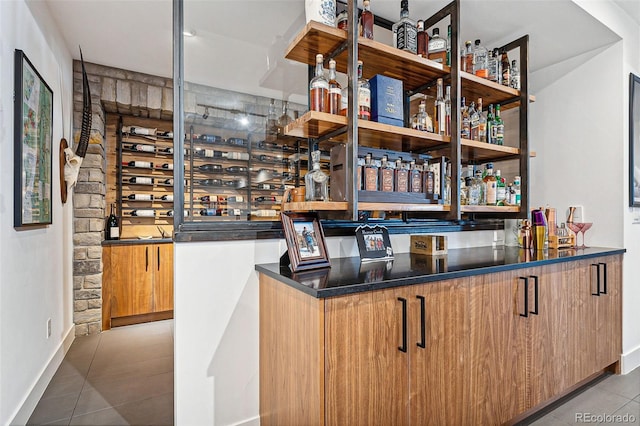 bar featuring tile patterned floors