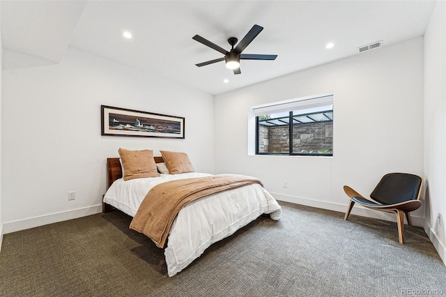 bedroom featuring dark carpet and ceiling fan