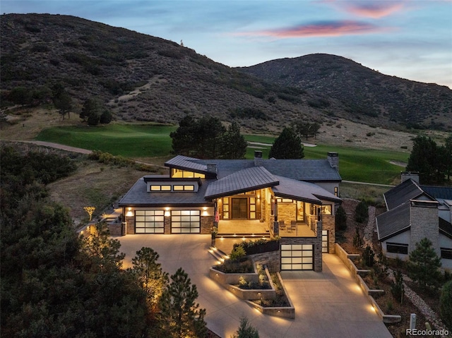 exterior space featuring a mountain view and a garage