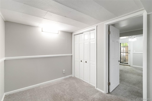 below grade area with carpet flooring and baseboards