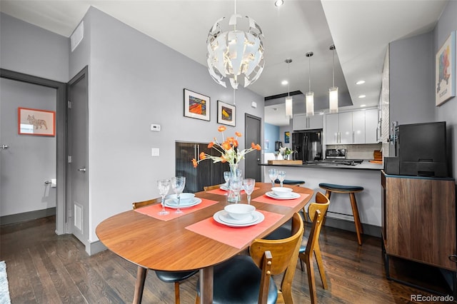 2539 Lawrence St, Denver, CO 80205 - dining space with dark wood finished floors, a chandelier, and recessed lighting