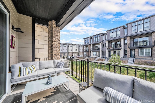 balcony featuring outdoor lounge area and a residential view