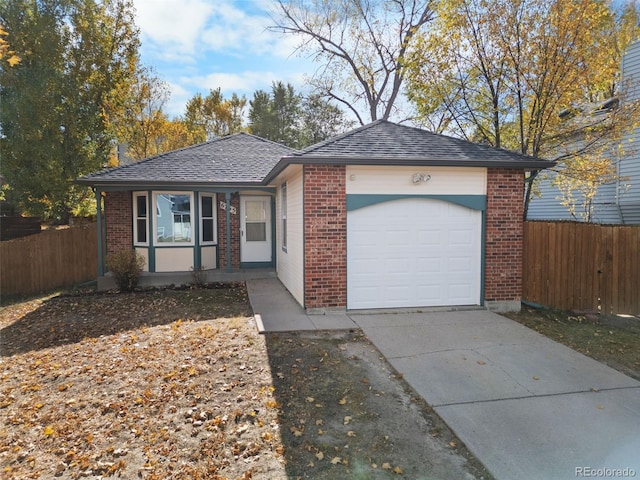 ranch-style home featuring a garage