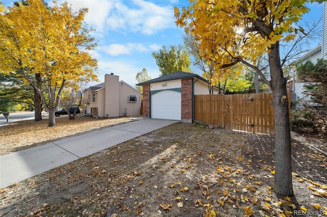 view of side of property with a garage