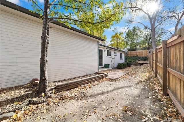 view of side of home with a patio