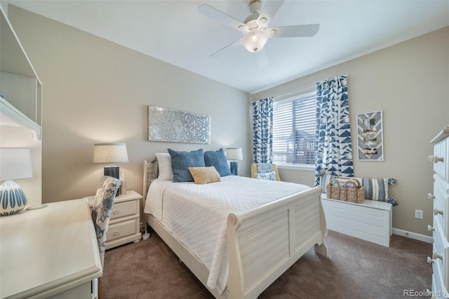 bedroom featuring dark carpet, baseboards, and ceiling fan