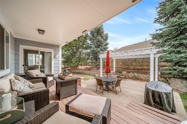 view of patio featuring a pergola, a deck, an outdoor hangout area, visible vents, and outdoor dining space