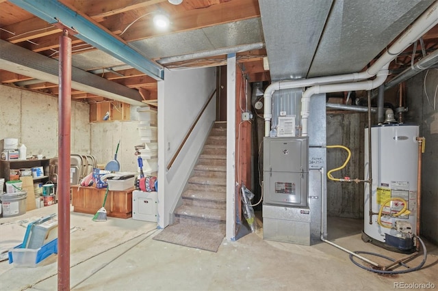 unfinished below grade area with stairs, gas water heater, and heating unit