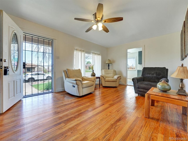 675 S Quivas St, Denver, CO 80223 - living area featuring ceiling fan and light wood-style floors