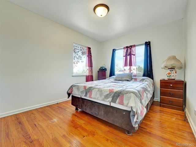 675 S Quivas St, Denver, CO 80223 - bedroom featuring baseboards and light wood-style flooring