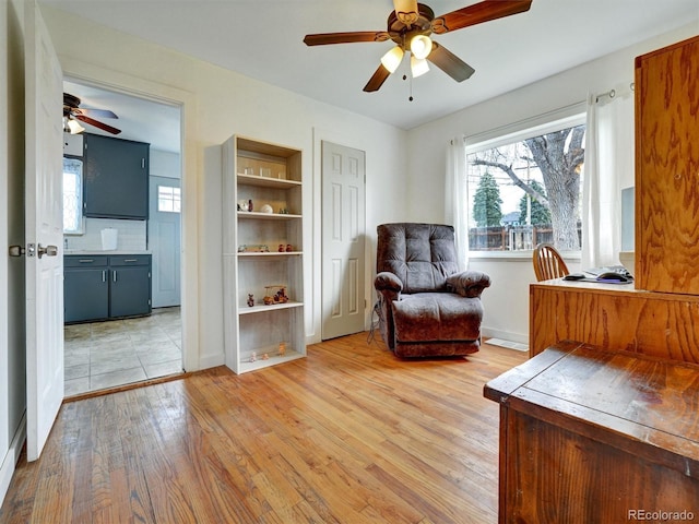 675 S Quivas St, Denver, CO 80223 - interior space featuring light wood-type flooring, baseboards, and ceiling fan