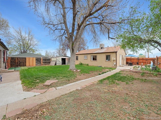 675 S Quivas St, Denver, CO 80223 - view of yard featuring a fenced backyard