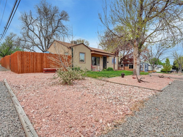 675 S Quivas St, Denver, CO 80223 - view of front of property featuring stucco siding and fence