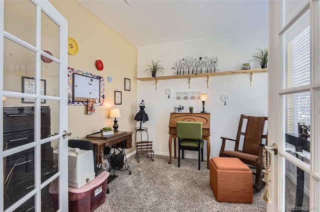 sitting room featuring carpet and baseboards
