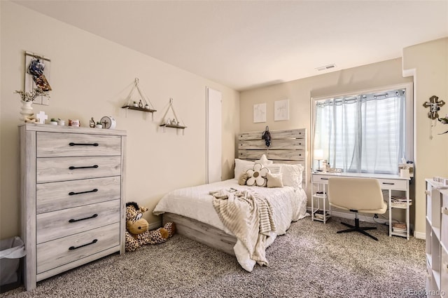 carpeted bedroom with baseboards