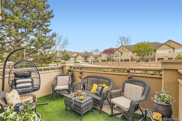 balcony featuring a residential view and an outdoor hangout area