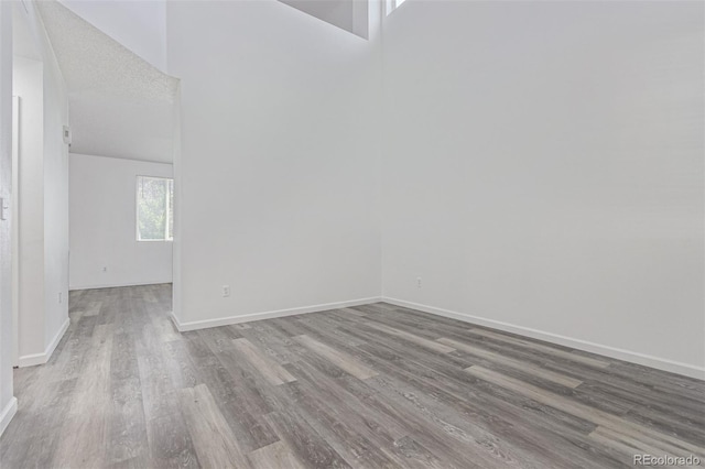 19466 E 59th Dr, Aurora, CO 80019 - spare room with wood finished floors and baseboards
