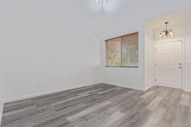 19466 E 59th Dr, Aurora, CO 80019 - entryway featuring a chandelier, wood finished floors, and healthy amount of natural light