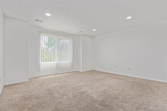19466 E 59th Dr, Aurora, CO 80019 - carpeted empty room featuring recessed lighting and a textured ceiling