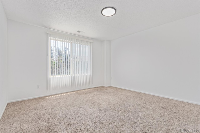 19466 E 59th Dr, Aurora, CO 80019 - spare room with carpet flooring and a textured ceiling