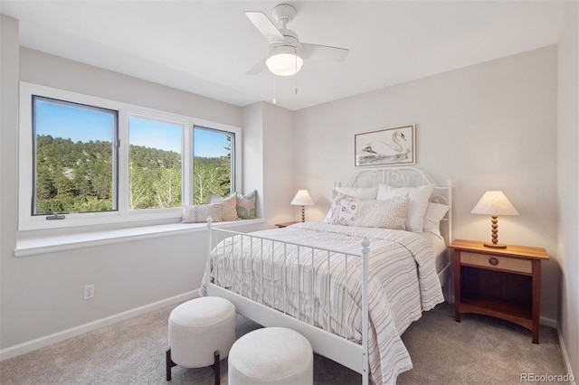 31402 N Bermuda Dunes Dr, Evergreen, CO 80439 - carpeted bedroom with baseboards and ceiling fan
