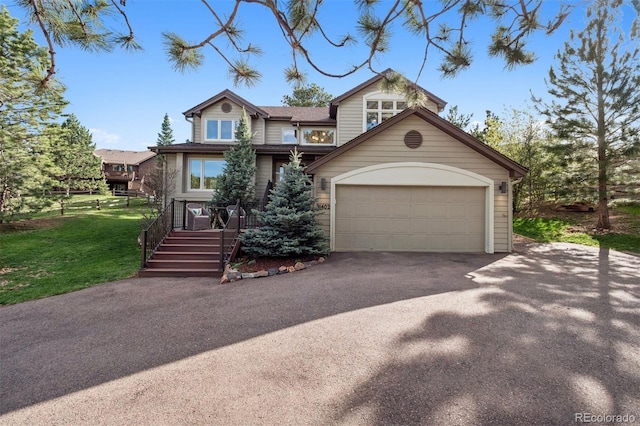31402 N Bermuda Dunes Dr, Evergreen, CO 80439 - view of front facade with driveway, a front yard, and an attached garage