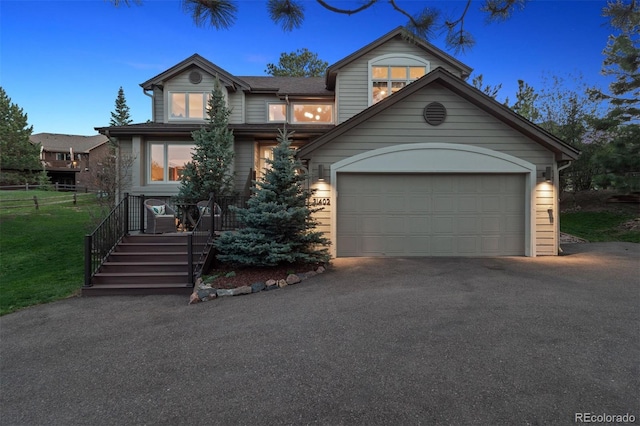 31402 N Bermuda Dunes Dr, Evergreen, CO 80439 - view of front of house featuring driveway and a garage