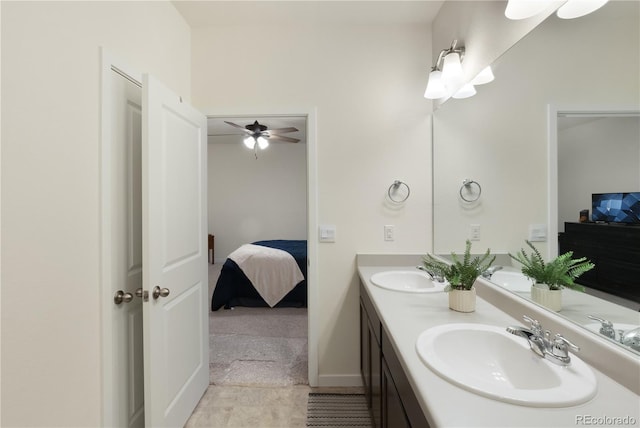 bathroom featuring tile patterned flooring, ceiling fan, and vanity