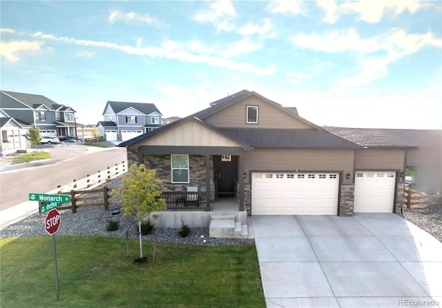 view of front of property with a garage and a front yard