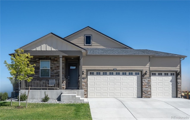 view of front of property featuring a garage and covered porch