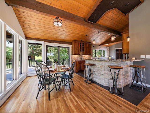 31756 Buffalo Park Rd, Evergreen, CO 80439 - dining space featuring wood ceiling, baseboard heating, and light wood-style flooring