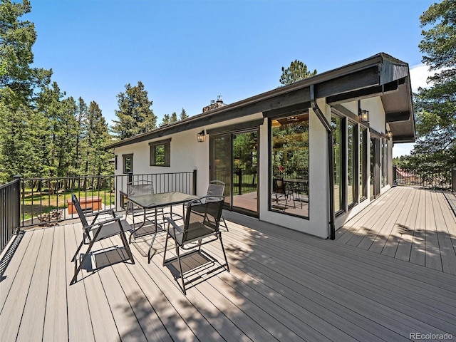 31756 Buffalo Park Rd, Evergreen, CO 80439 - wooden terrace featuring outdoor dining area