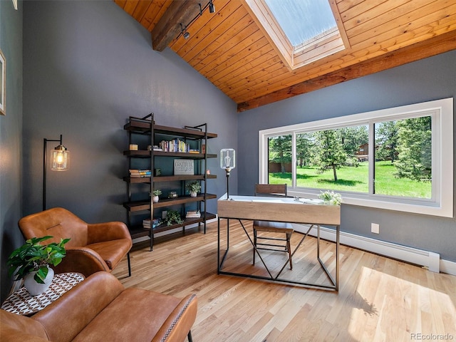 31756 Buffalo Park Rd, Evergreen, CO 80439 - office area featuring wooden ceiling, wood finished floors, a baseboard heating unit, a skylight, and baseboards