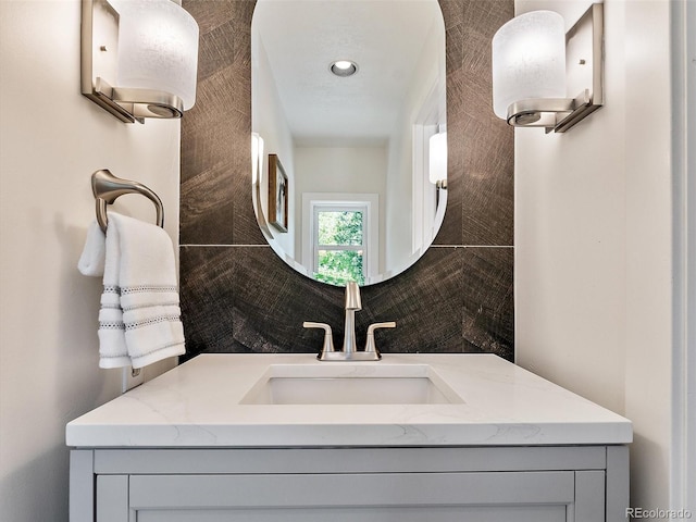 31756 Buffalo Park Rd, Evergreen, CO 80439 - bathroom featuring vanity and tasteful backsplash