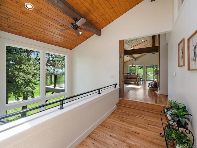 31756 Buffalo Park Rd, Evergreen, CO 80439 - hallway featuring wooden ceiling with exposed beams, light wood-style floors, baseboards, and high vaulted ceiling