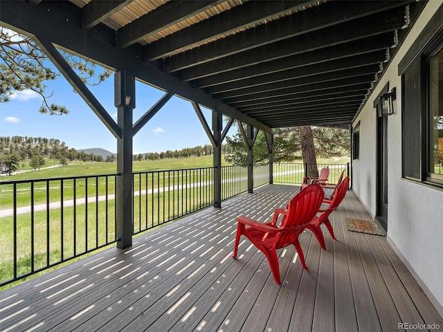 31756 Buffalo Park Rd, Evergreen, CO 80439 - deck featuring a mountain view and a lawn