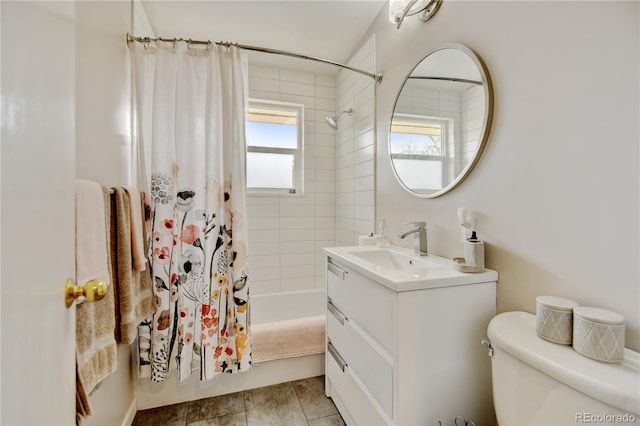 bathroom featuring shower / bath combination with curtain, toilet, and vanity