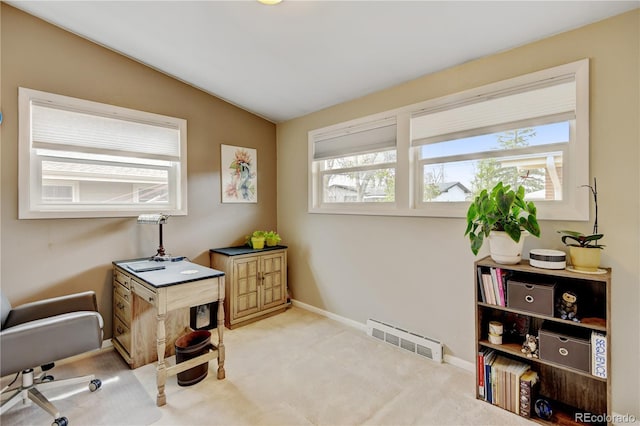 office area featuring vaulted ceiling, carpet floors, and baseboards